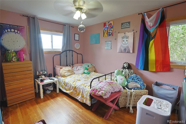 bedroom featuring hardwood / wood-style flooring and ceiling fan