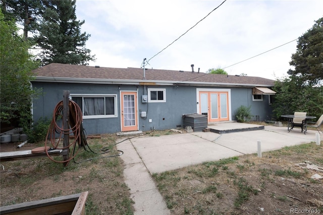 back of house with french doors and a patio area