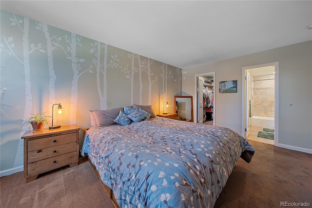 bedroom with wallpapered walls, a closet, a spacious closet, and carpet flooring