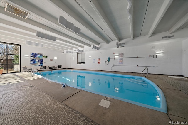 community pool featuring an AC wall unit