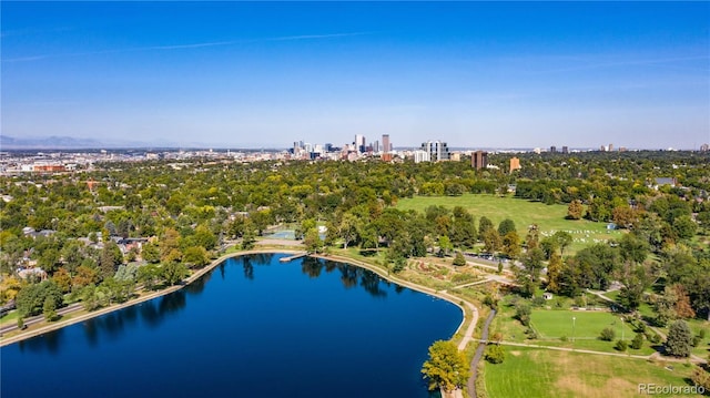 drone / aerial view featuring a view of city and a water view