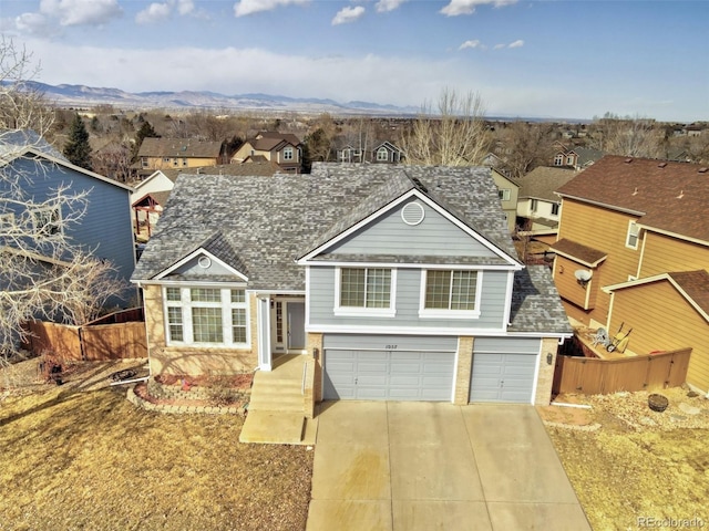 view of front of home featuring a mountain view and a garage