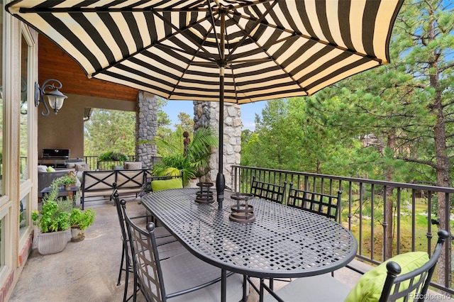 view of patio featuring outdoor dining area
