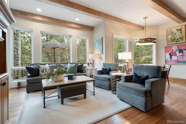 living room with recessed lighting, baseboards, beam ceiling, and hardwood / wood-style flooring