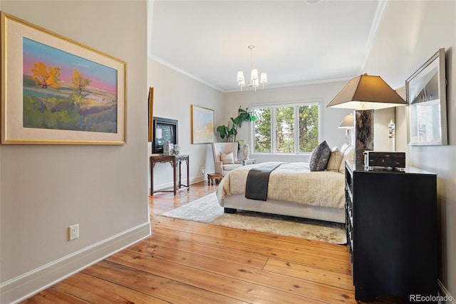 bedroom featuring crown molding, baseboards, a notable chandelier, and hardwood / wood-style floors