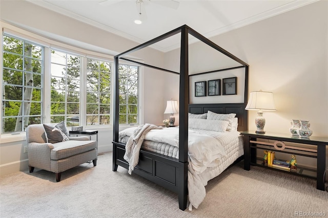 bedroom with crown molding, a ceiling fan, carpet flooring, and baseboards