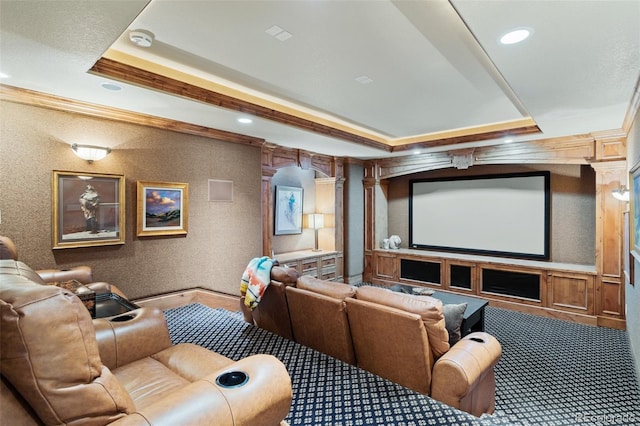 cinema room with crown molding, carpet flooring, a raised ceiling, recessed lighting, and decorative columns