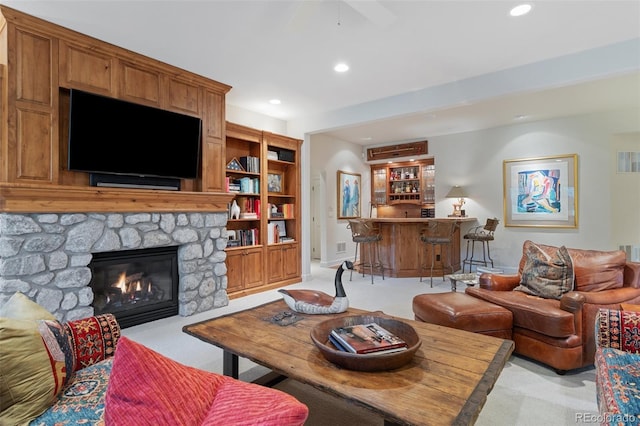 living room featuring indoor wet bar, recessed lighting, and light carpet