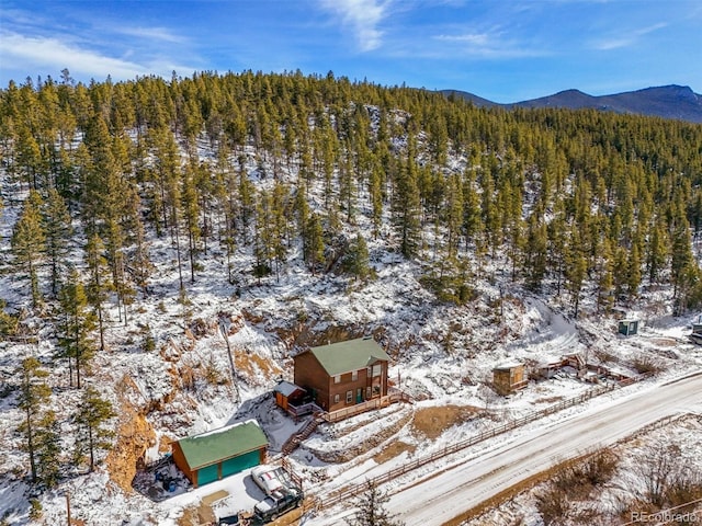 snowy aerial view with a mountain view