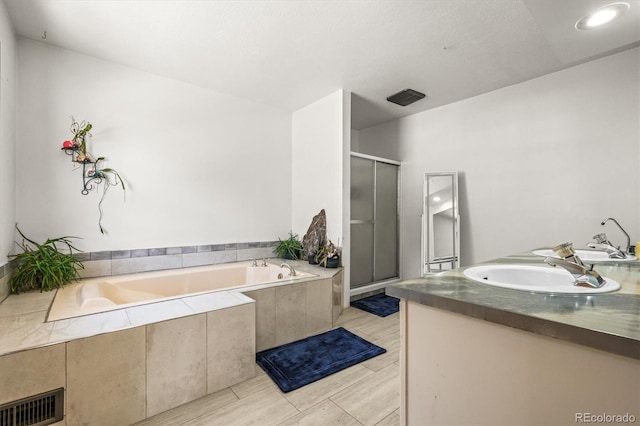 2476 S Beaver Creek Rd, Black Hawk, CO 80422 - bathroom featuring a shower stall, a bath, and double vanity