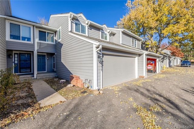 view of property exterior with a garage