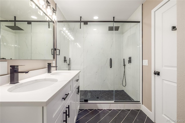 bathroom with tile patterned flooring, vanity, and a shower with shower door