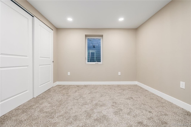 unfurnished bedroom featuring a closet and carpet