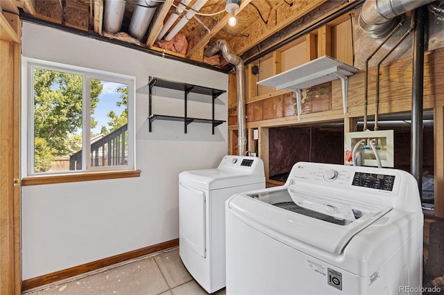 7345 W 97th Pl, Broomfield, CO 80021 - washroom featuring washer and dryer and baseboards