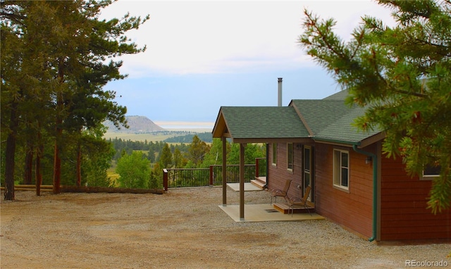 exterior space with a patio and a mountain view