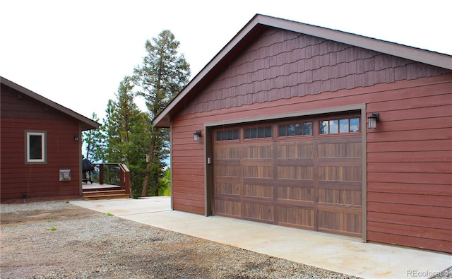 garage featuring wood walls