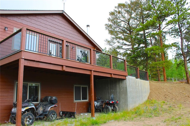 rear view of property with a deck