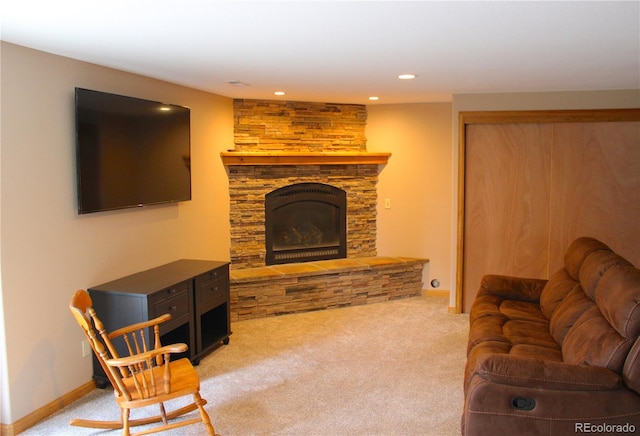 living room with light colored carpet and a fireplace