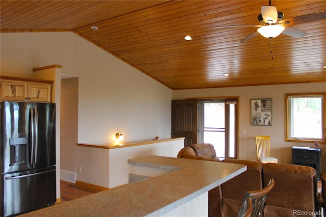 kitchen with stainless steel fridge with ice dispenser, wood ceiling, lofted ceiling, and a wealth of natural light