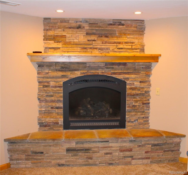 details with carpet flooring and a fireplace