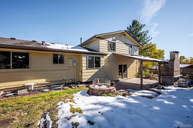 back of property with a patio