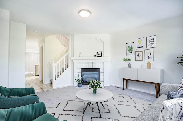 carpeted living room featuring a fireplace