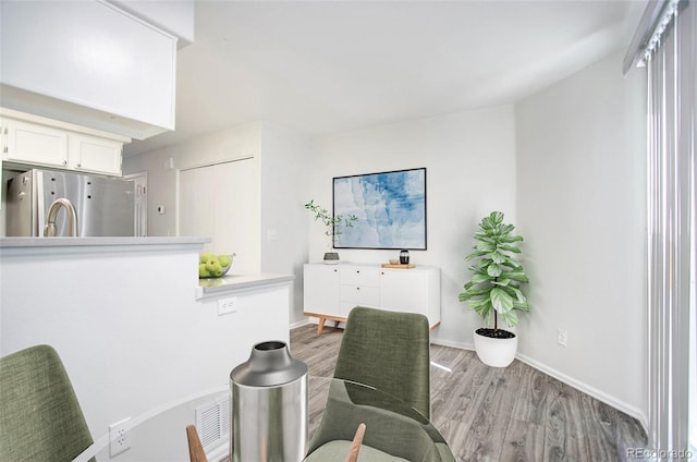 office space with light hardwood / wood-style flooring