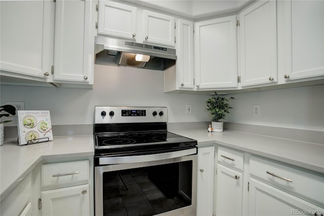 kitchen featuring white cabinets and electric stove