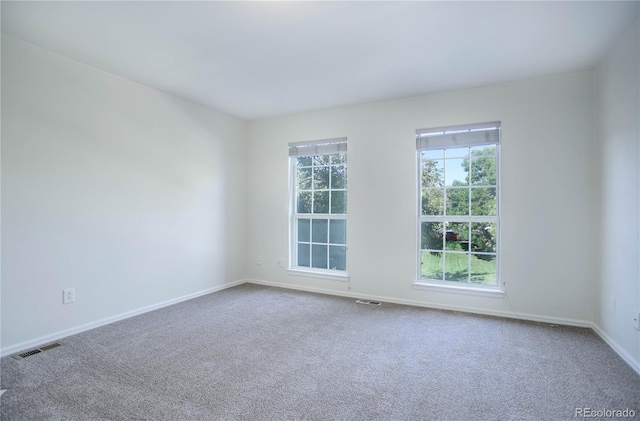 empty room featuring carpet flooring