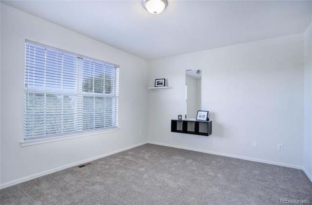 unfurnished room featuring carpet floors