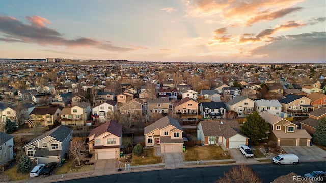 aerial view at dusk with a residential view