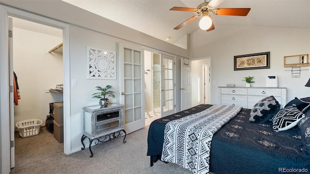 bedroom featuring vaulted ceiling, carpet flooring, french doors, a textured ceiling, and a ceiling fan