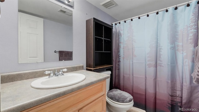 full bath with visible vents, toilet, vanity, and a shower with curtain