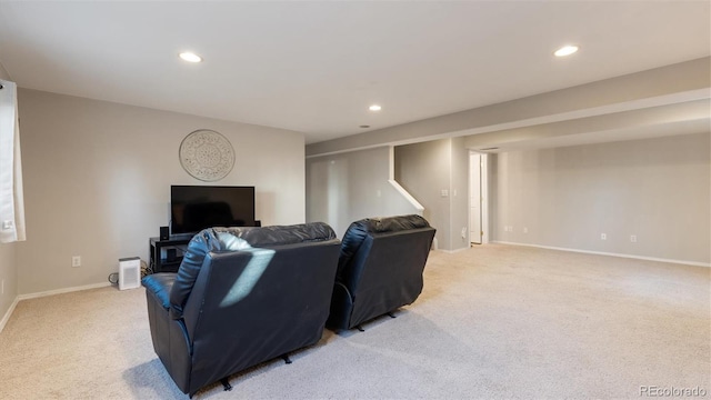 living room with recessed lighting, baseboards, and light carpet