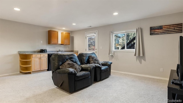 living room featuring light carpet, recessed lighting, and baseboards