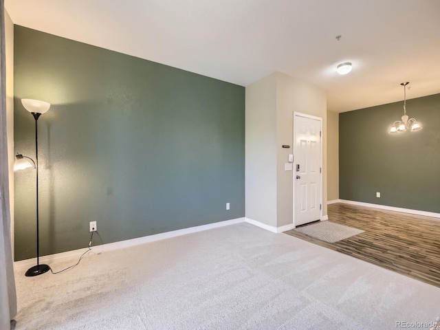 2133 Krisron Rd Unit A202, Fort Collins, CO 80525 - unfurnished room with carpet, a chandelier, and fire sprinkler in ceiling