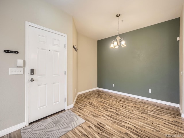 2133 Krisron Rd Unit A202, Fort Collins, CO 80525 - entrance foyer featuring wood finished floors and a chandelier