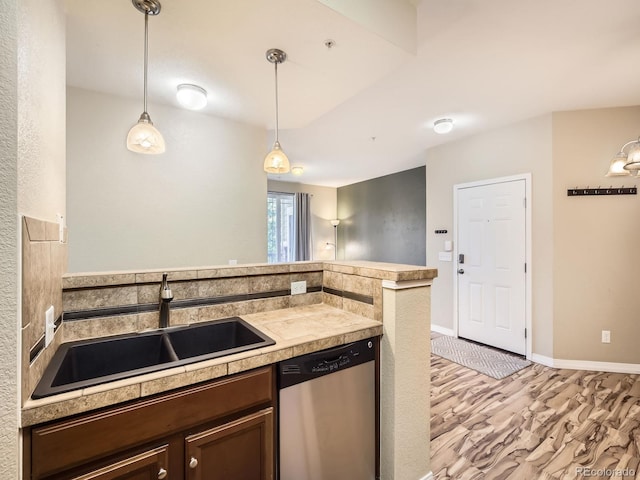 2133 Krisron Rd Unit A202, Fort Collins, CO 80525 - kitchen with dishwasher, light wood-type flooring, pendant lighting, dark brown cabinets, and a peninsula