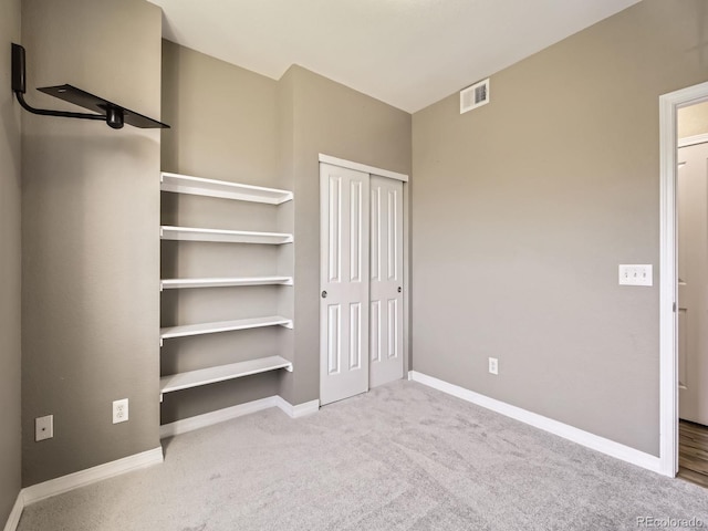 2133 Krisron Rd Unit A202, Fort Collins, CO 80525 - unfurnished bedroom with a closet and carpet