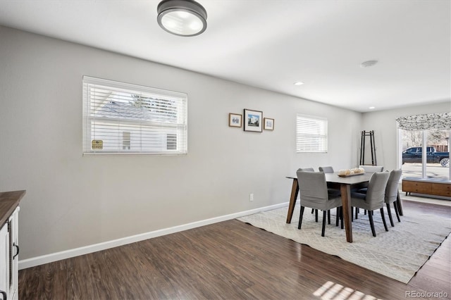 dining room featuring recessed lighting, baseboards, and wood finished floors