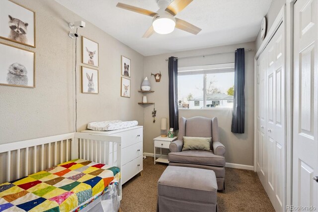 bedroom featuring a ceiling fan, carpet, baseboards, and a closet