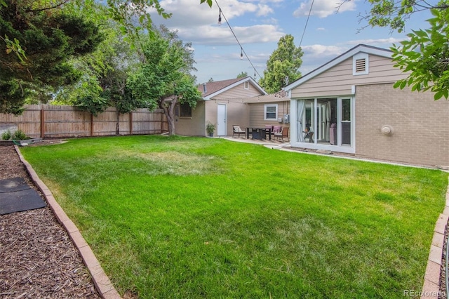 view of yard with a patio area and fence