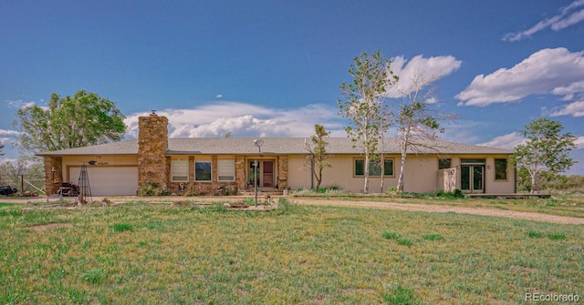 ranch-style home with a garage and a front lawn