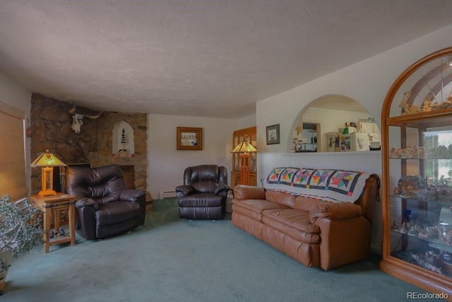 carpeted living room featuring a baseboard radiator and a textured ceiling