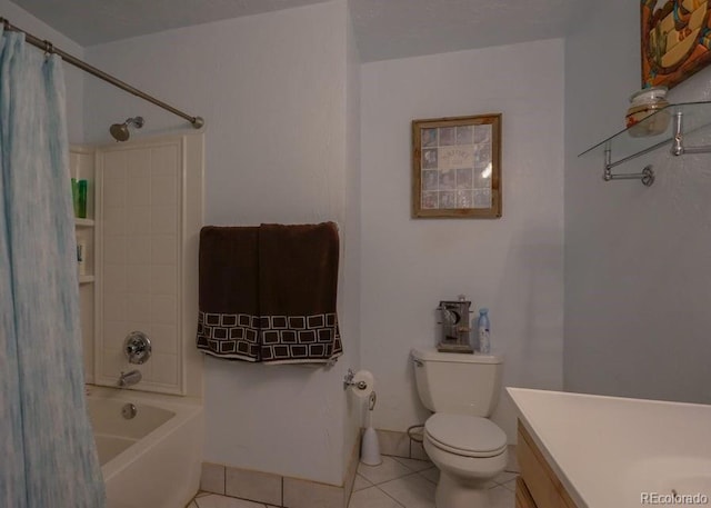 full bathroom with tile patterned flooring, vanity, toilet, and shower / bath combo with shower curtain