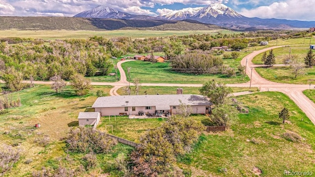 aerial view featuring a mountain view and a rural view