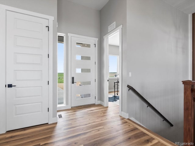 62101 E 32nd Ct, Strasburg, CO 80136 - foyer entrance with light wood-type flooring and baseboards