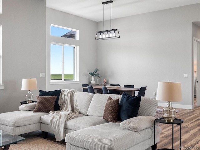 62101 E 32nd Ct, Strasburg, CO 80136 - living area featuring light wood finished floors
