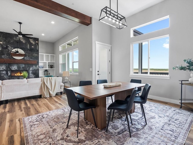 62101 E 32nd Ct, Strasburg, CO 80136 - dining room with ceiling fan, wood finished floors, recessed lighting, baseboards, and a high end fireplace