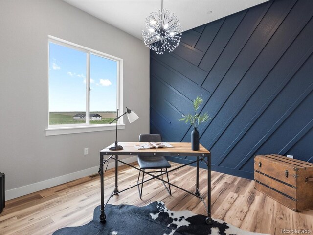62101 E 32nd Ct, Strasburg, CO 80136 - office area featuring baseboards, light wood-style floors, and a chandelier